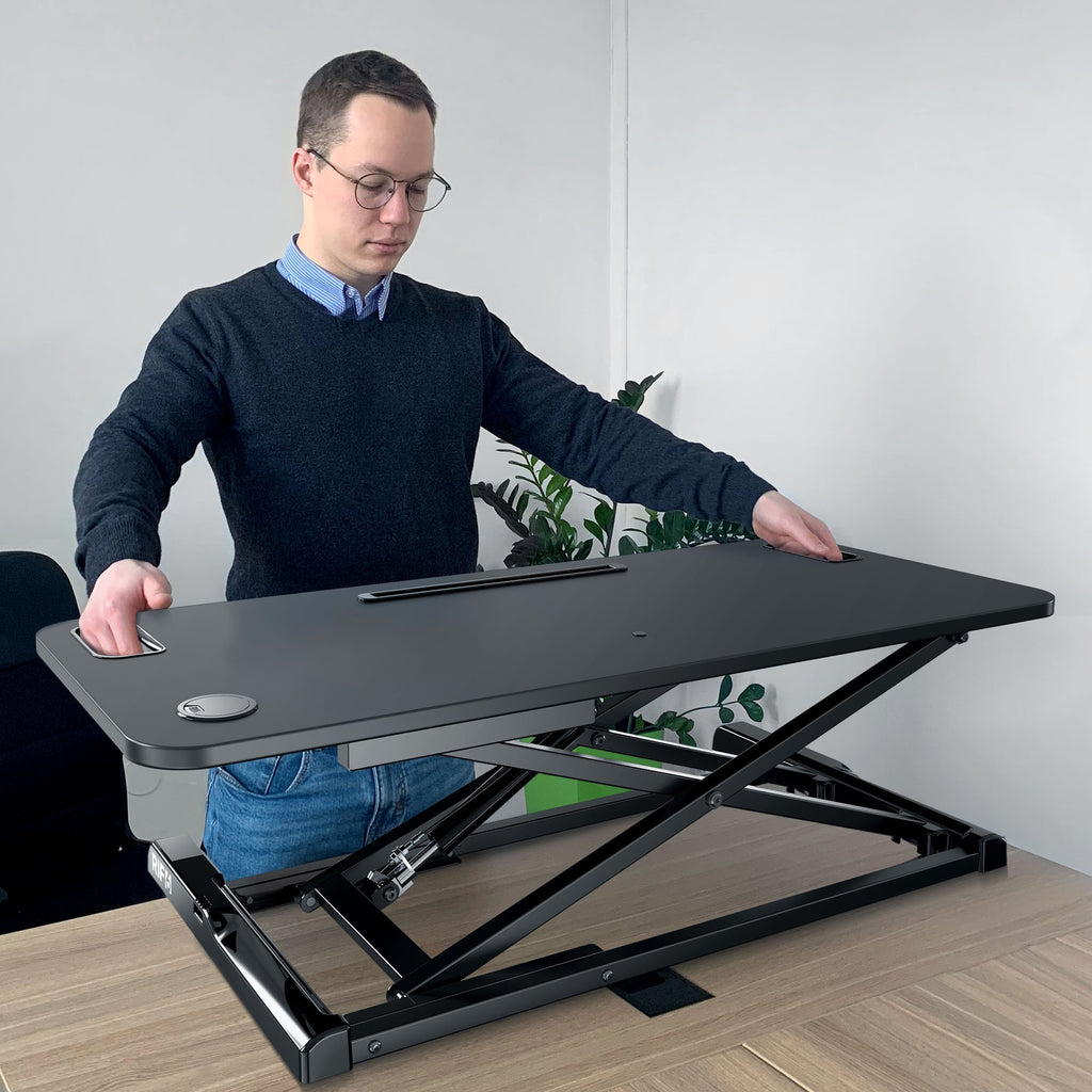 Height Adjustable Standing Desk 37 inch man demonstrating how to use the desk